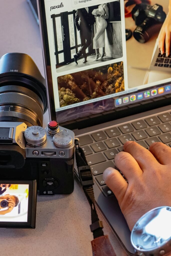 Professional reviewing photographs on a laptop