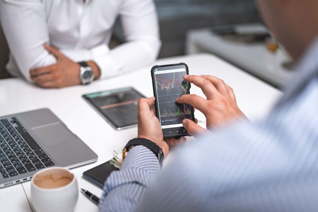 Professional working with a smartphone and business data